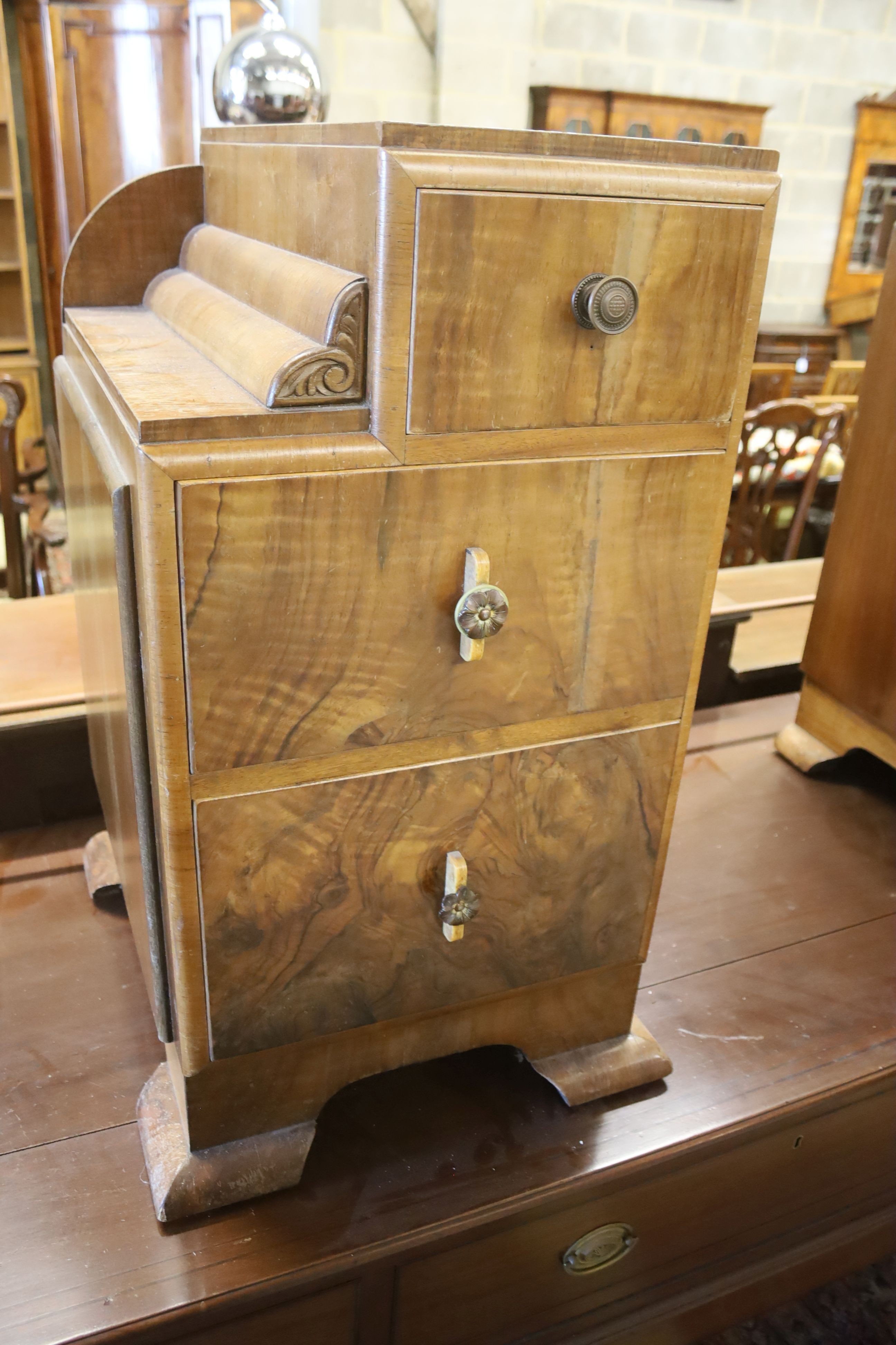 A pair of Art Deco style figured walnut bedside cabinets, width 40cm, depth 46cm, height 73cm